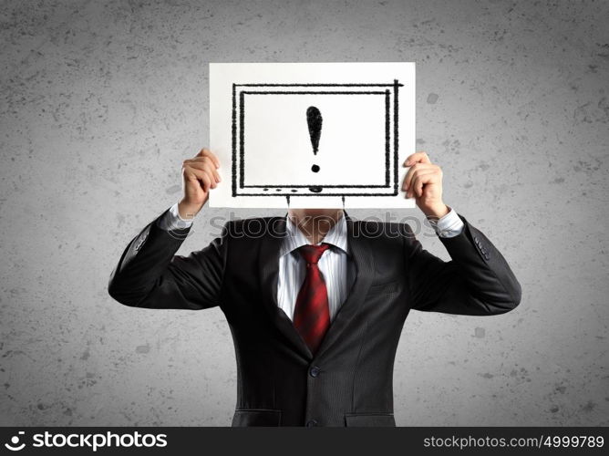 Business man with board. Image of businessman holding message board against face. Conceptual photo