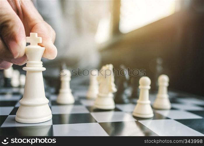 business man with chess board game, strategy and competition.
