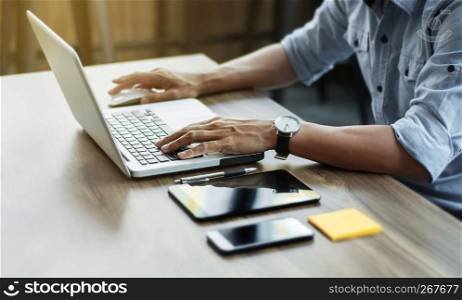 Business man working at office with laptop and documents on his desk freelancer concept.