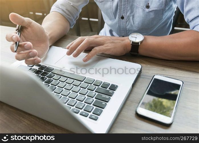 Business man working at office with laptop and documents on his desk freelancer concept.