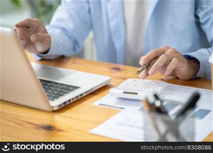 Business man working by using laptop computer Hands typing on a keyboard. Professional investor working new start up project. business planning in office. Technology business Concept