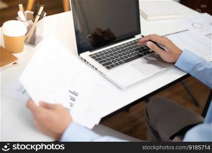 Business man working by using laptop computer Hands typing on a keyboard. Professional investor working new start up project. business planning in office. Technology business Concept. 