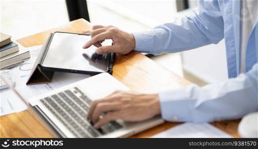Business man working by using laptop computer Hands typing on a keyboard. Professional investor working new start up project. business planning in office. Technology business Concept