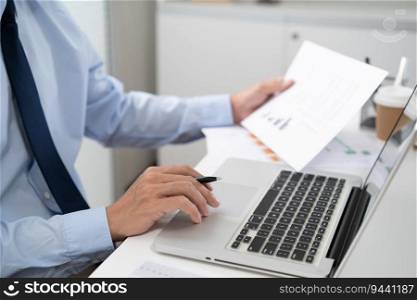 Business man working by using laptop computer Hands typing on a keyboard. Professional investor working new start up project. business planning in office. Technology business Concept. 