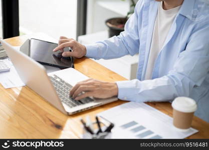 Business man working by using laptop computer Hands typing on a keyboard. Professional investor working new start up project. business planning in office. Technology business Concept