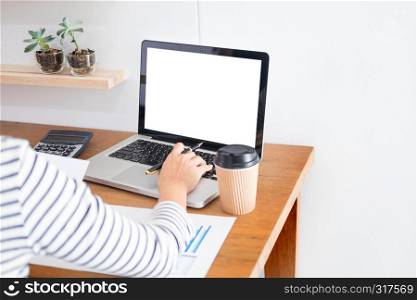 business man working on a laptop tablet and graph data documents on his desk in home office