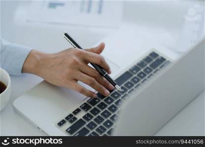 Business man working using laptop computer Hands typing keyboard. Professional investor working start up project. business planning in office. Technology business Concept. 