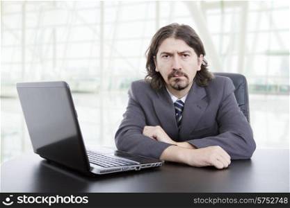 business man working with is laptop at the office