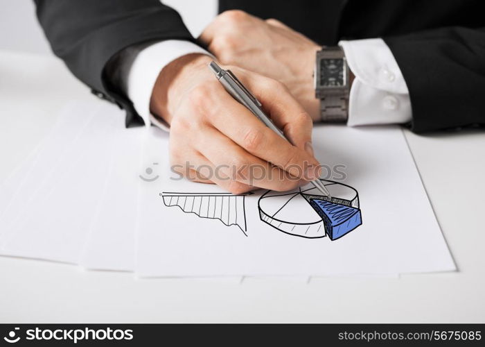 business, marketing, planning and people concept - close up of male hand with pen drawing graph on white paper