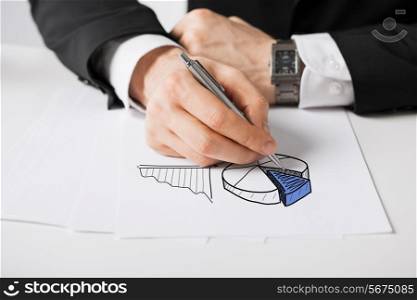 business, marketing, planning and people concept - close up of male hand with pen drawing graph on white paper