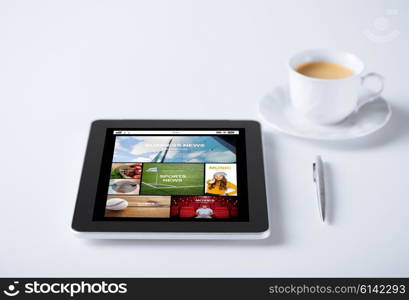 business, mass media and technology concept - tablet pc computer with internet news application cup of coffee