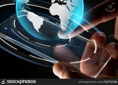 business, mass media, people and future technology concept - close up of hands with transparent smartphone and virtual earth hologram over black background. close up of hands with smartphone and earth