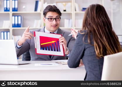 Business meeting between businessman and businesswoman