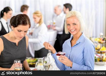 Business meeting buffet smiling woman eat dessert formal company event