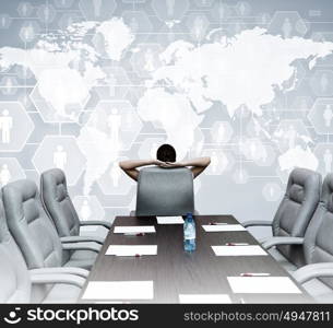 Business meeting. Businesswoman boss in conference room sitting with back in chair