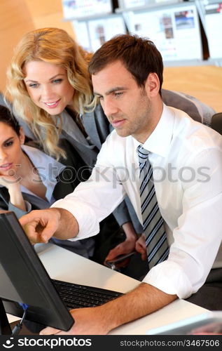 Business meeting in front of desktop computer