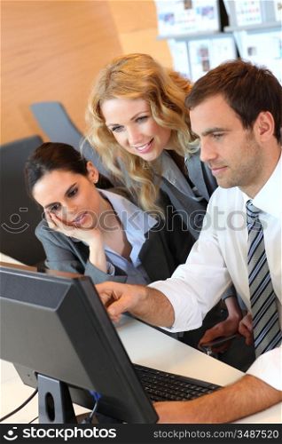 Business meeting in front of desktop computer