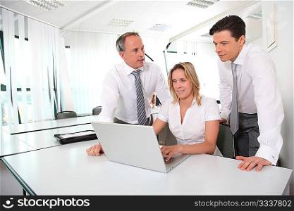 Business meeting in front of laptop computer