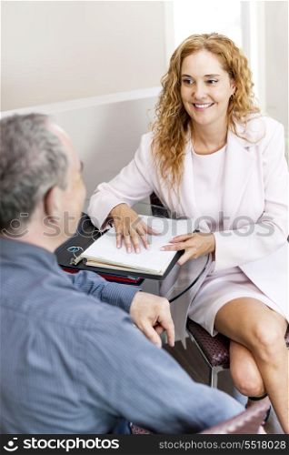 Business meeting in office. Man and woman discussing work in business office