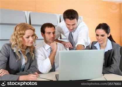 Business meeting in office with laptop computer
