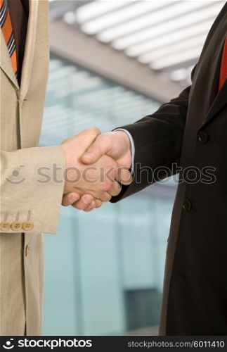Business men hand shake in white background