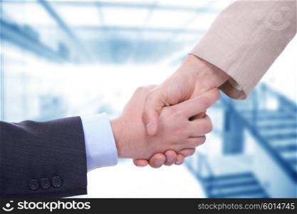 Business men in a handshake at the office