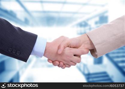 Business men in a handshake at the office