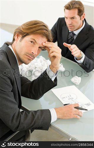 Business men working at conference table