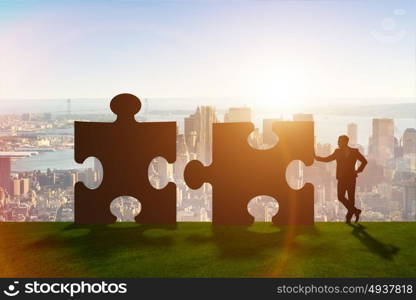 Business metaphor of teamwork with jigsaw puzzle