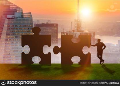 Business metaphor of teamwork with jigsaw puzzle