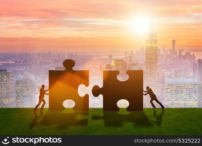 Business metaphor of teamwork with jigsaw puzzle