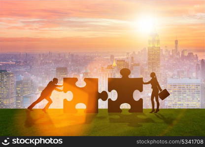 Business metaphor of teamwork with jigsaw puzzle