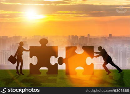 Business metaphor of teamwork with jigsaw puzzle