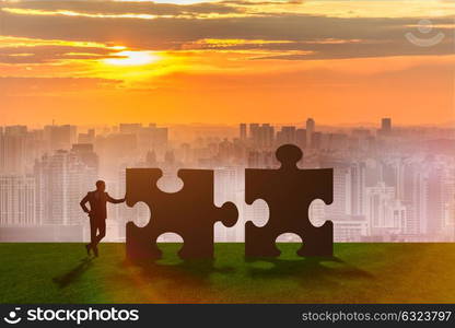 Business metaphor of teamwork with jigsaw puzzle