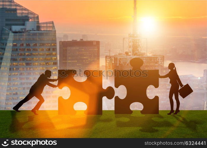 Business metaphor of teamwork with jigsaw puzzle