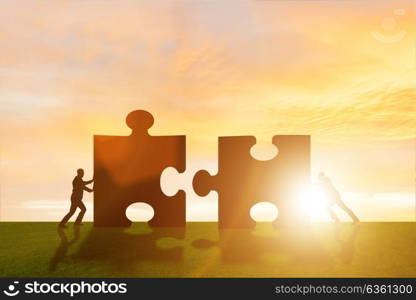 Business metaphor of teamwork with jigsaw puzzle