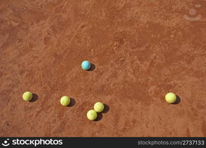 Business metaphor with tennis balls on cort