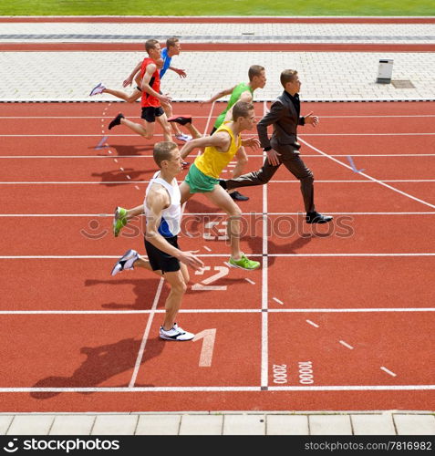 Business metaphore of staying ahead, winning in business,business competition, and continuous improvement, represented by a photo finish of a track race