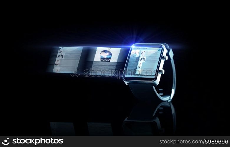 business, modern technology, object, internet and media concept - close up of black smart watch with web page on screen over black background