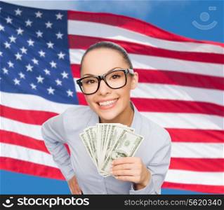 business, money and banking concept - smiling businesswoman in eyeglasses with dollar cash money over american flag background