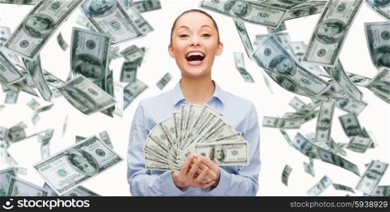 business, money, finance, people and banking concept - smiling businesswoman with heap of dollar cash money