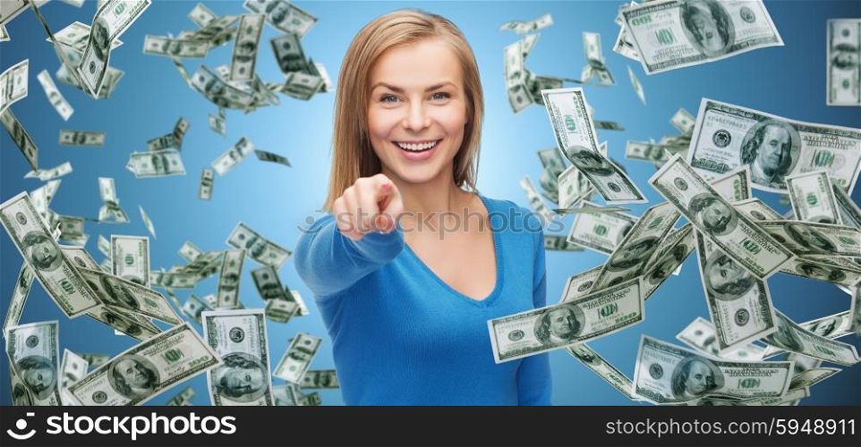business, money, finance, people and gesture concept - smiling woman with dollar cash money pointing finger on you over blue background