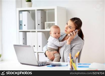 business, motherhood, multi-tasking, family and people concept - businesswoman with baby calling on smartphone at office. businesswoman with baby and smartphone at office