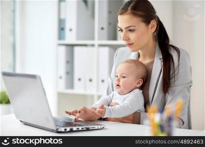 business, motherhood, multi-tasking, family and people concept - happy businesswoman with baby and laptop computer working at office