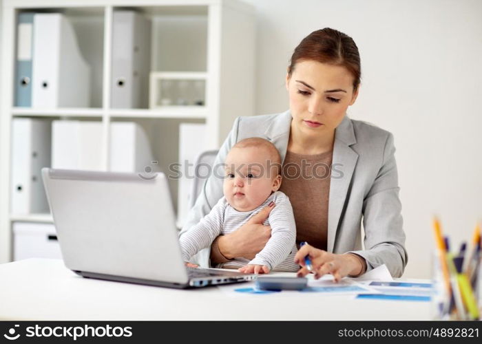 business, motherhood, multi-tasking, family and people concept - happy businesswoman with baby counting on calculator at office