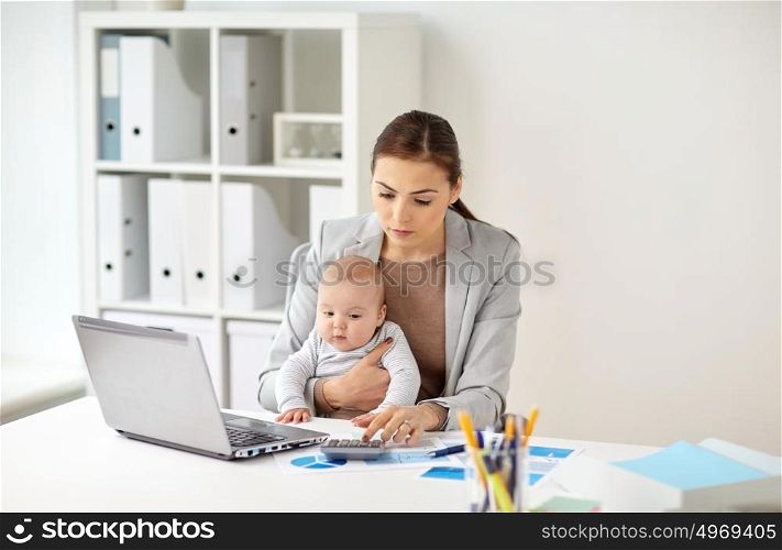 business, motherhood, multi-tasking, family and people concept - happy businesswoman with baby counting on calculator at office. businesswoman with baby working at office
