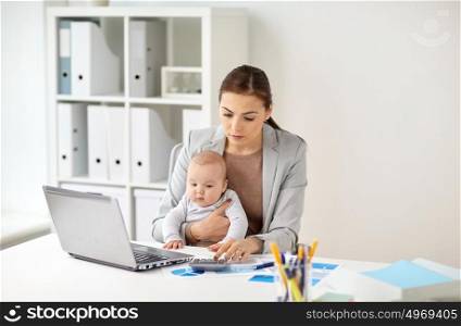 business, motherhood, multi-tasking, family and people concept - happy businesswoman with baby counting on calculator at office. businesswoman with baby working at office
