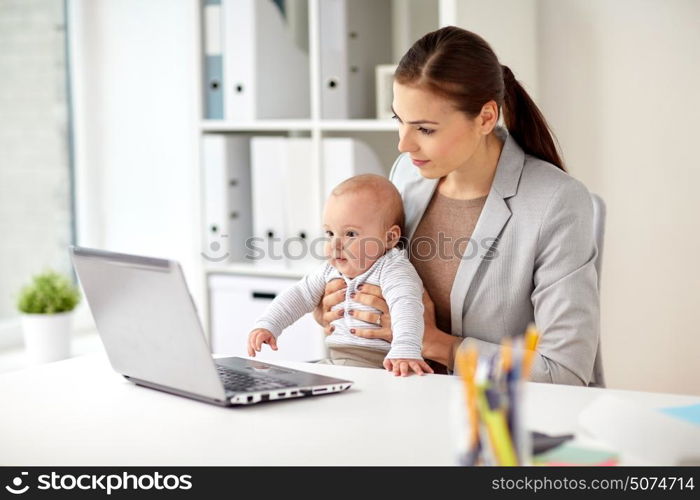 business, motherhood, multi-tasking, family and people concept - happy businesswoman with baby and laptop computer working at office. happy businesswoman with baby and laptop at office