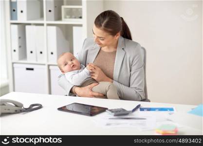 business, motherhood, multi-tasking, family and people concept - happy smiling businesswoman with baby working at office