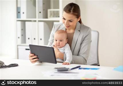 business, motherhood, multi-tasking, family and people concept - happy smiling businesswoman with baby and tablet pc computer working at office